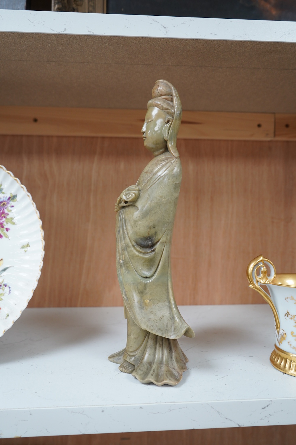 A Chinese soapstone figure of guanyin, 31cm high. Condition - good